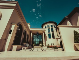 UniFi Access secures the courtyard entry, with AI facial recognition opening for homeowners.