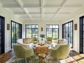 Architectural in-ceiling speakers blend into millwork, delivering even sound without visual distraction.