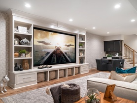 110" 4K projection system with 7.1 surround system. Front speakers behind screen, streaming and Savant Control