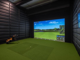 Crestron control with MXNet video and integrated golf simulator in an acoustically treated media room.