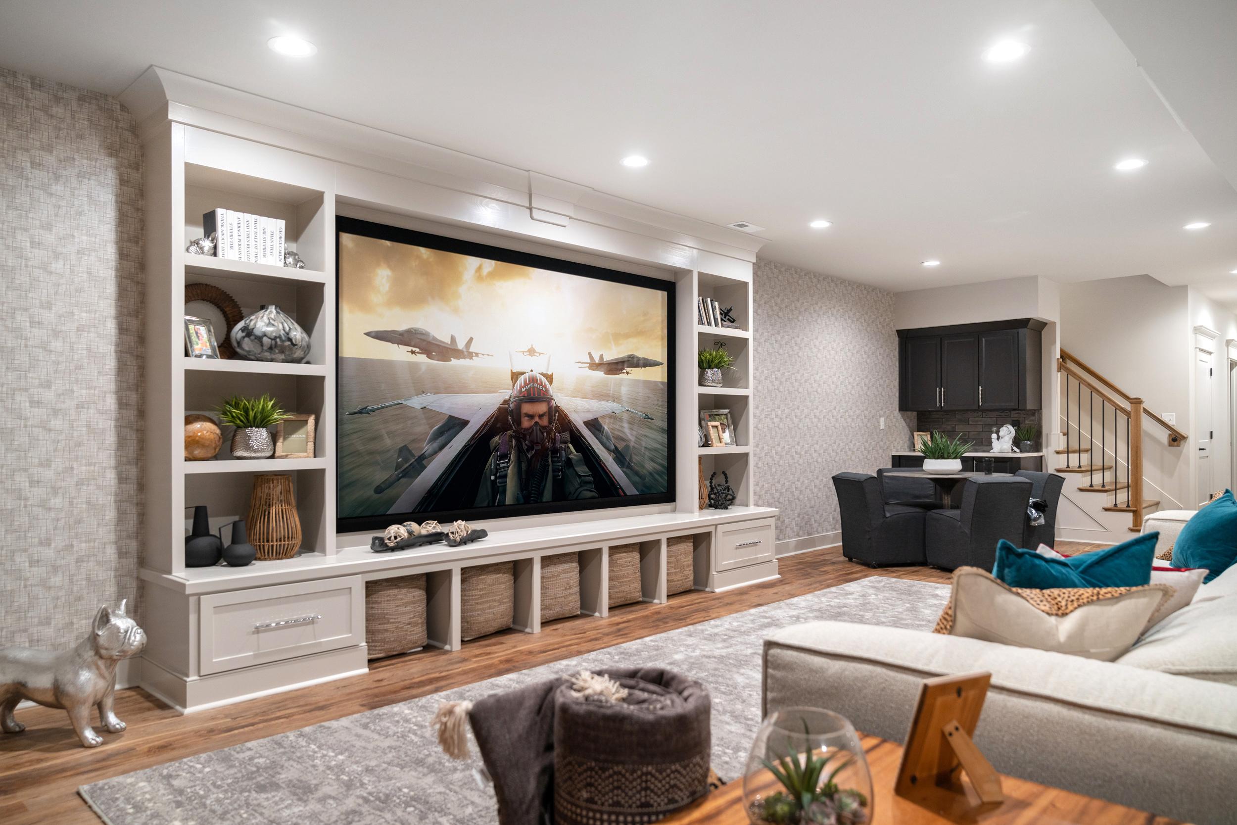 AUTOMATED LIVING LLC 110" 4K projection system with 7.1 surround system. Front speakers behind screen, streaming and Savant Control