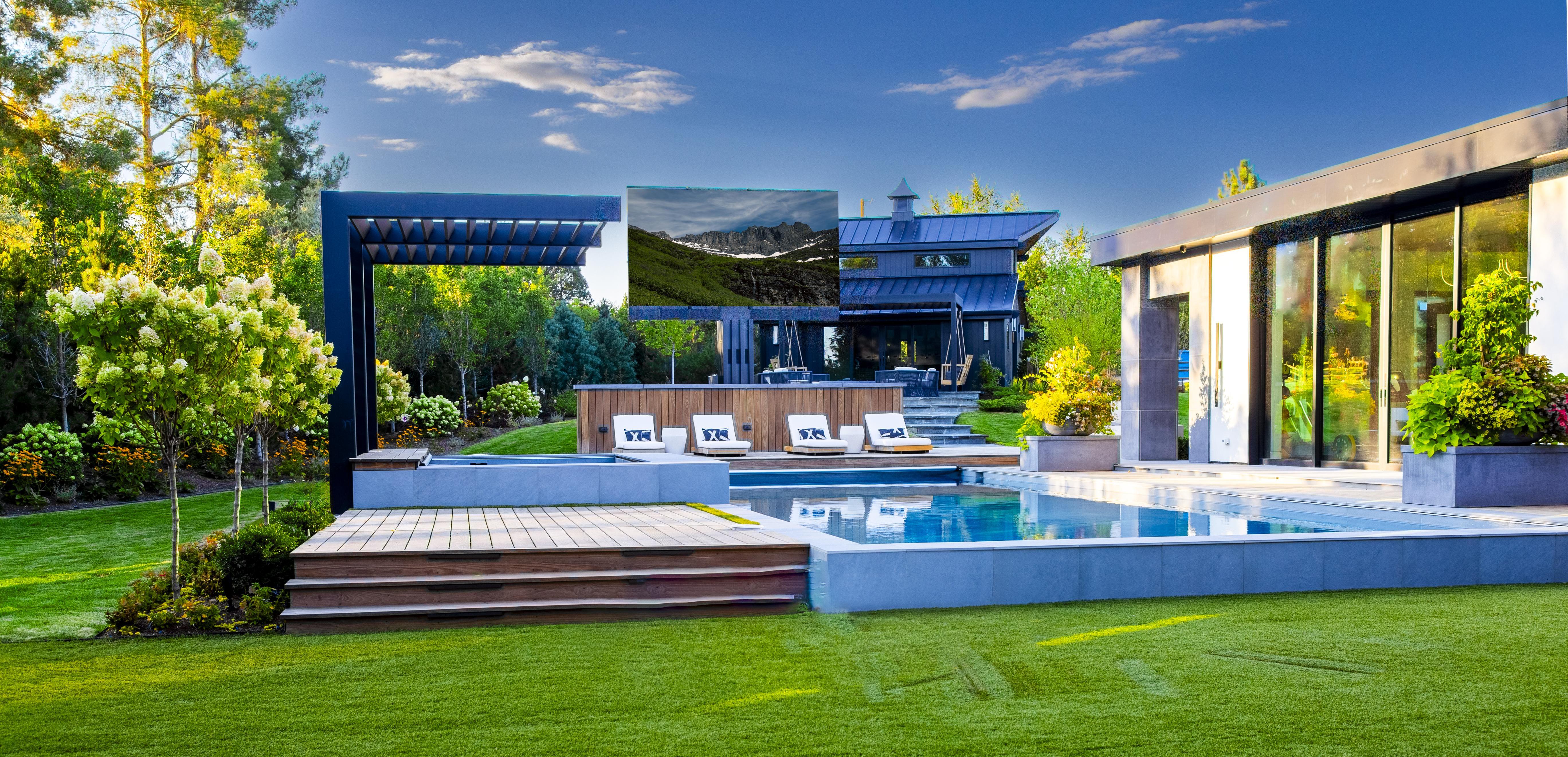 Precision Media Solutions 201-inch C-SEED outdoor TV in a backyard pool area. This unit features a 4K MicroLED display.