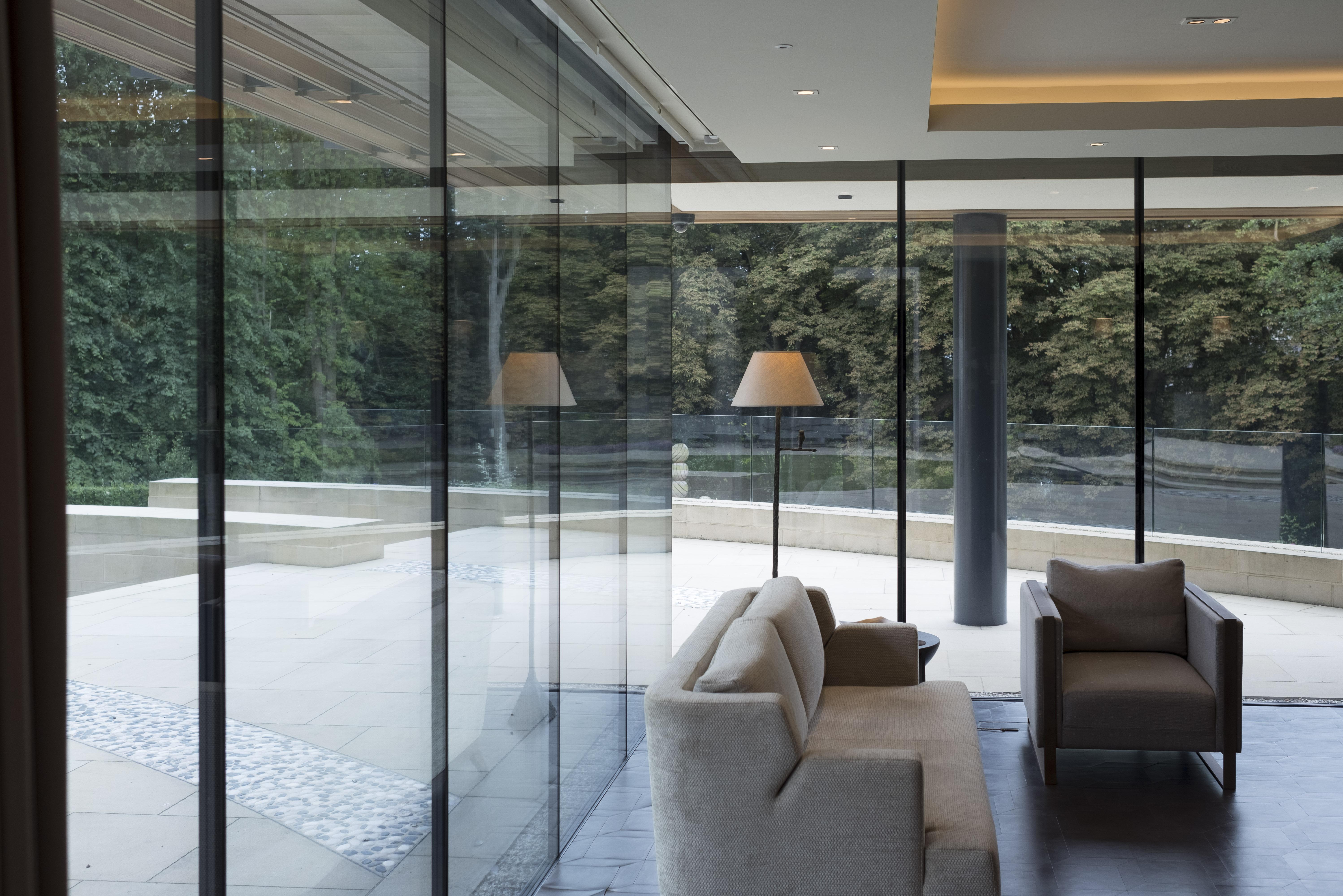 Clever Association Lutron HomeWorks lighting control and automation, with motorised roller shades and curtain tracks.