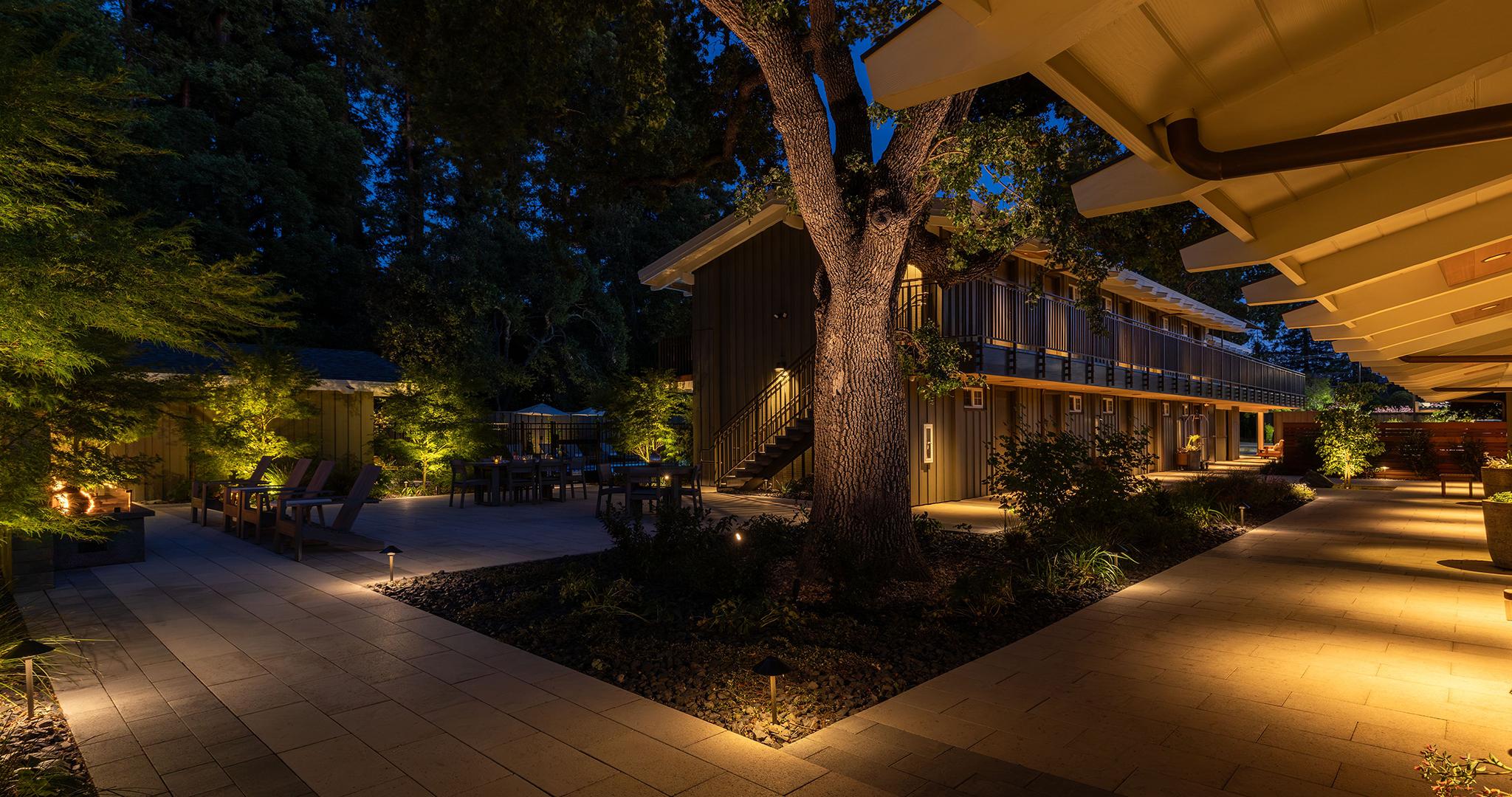 FX Luminaire FX Luminaire brings this outdoor retreat to life with layered lighting, enhancing trees, paths, & architecture