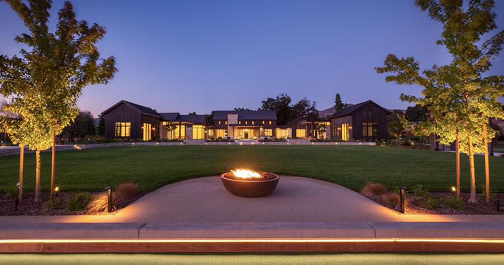 FX Luminaire FX Luminaire enhances this modern estate with layered lighting, guiding paths and highlighting architecture be