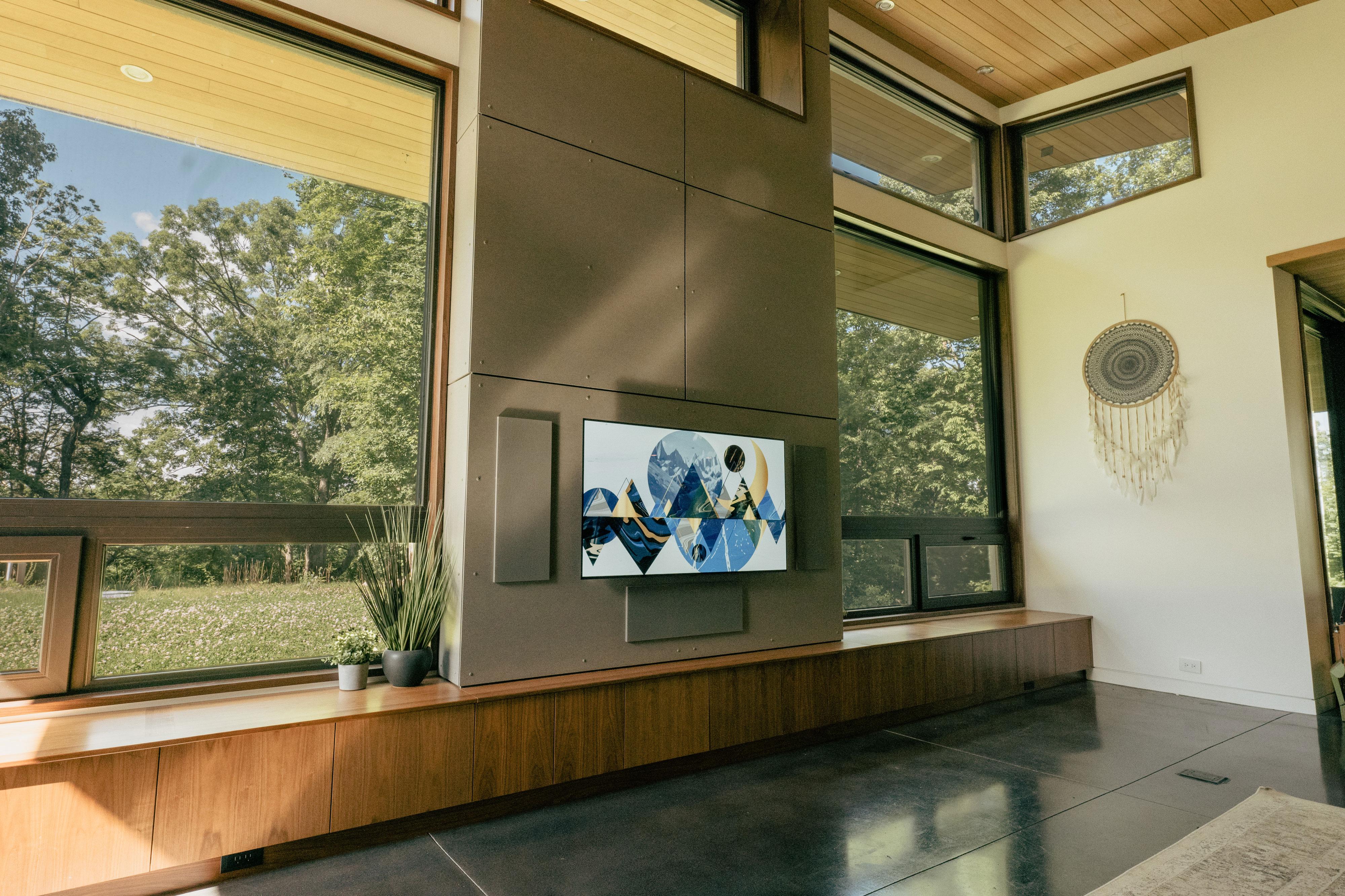 Audilux Hidden KEF THX Cinema Speakers flanking LG OLED TV.