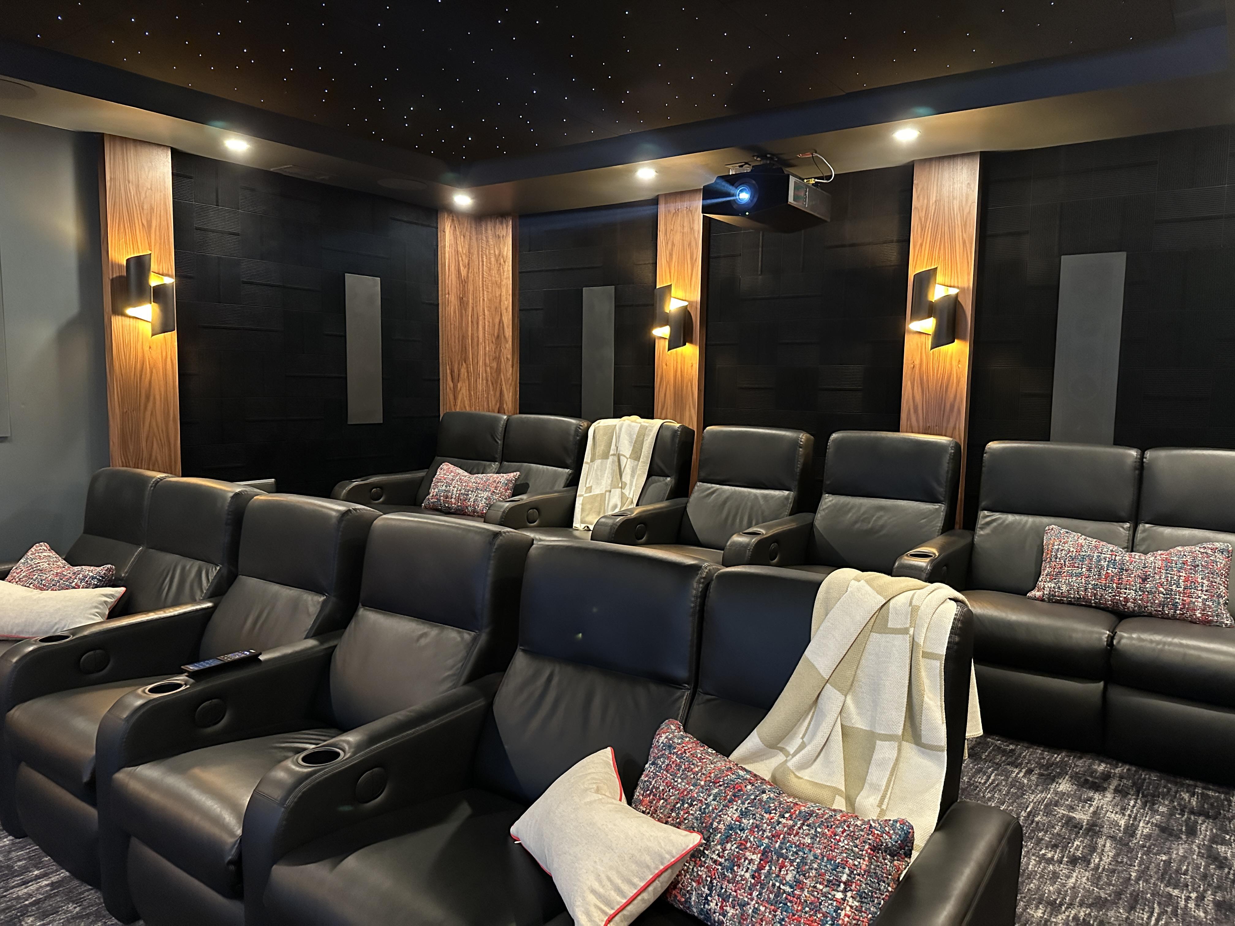 KOZI MEDIA DESIGN In this custom theater we designed in a unique acoustic treatment to compliment the audio and design.