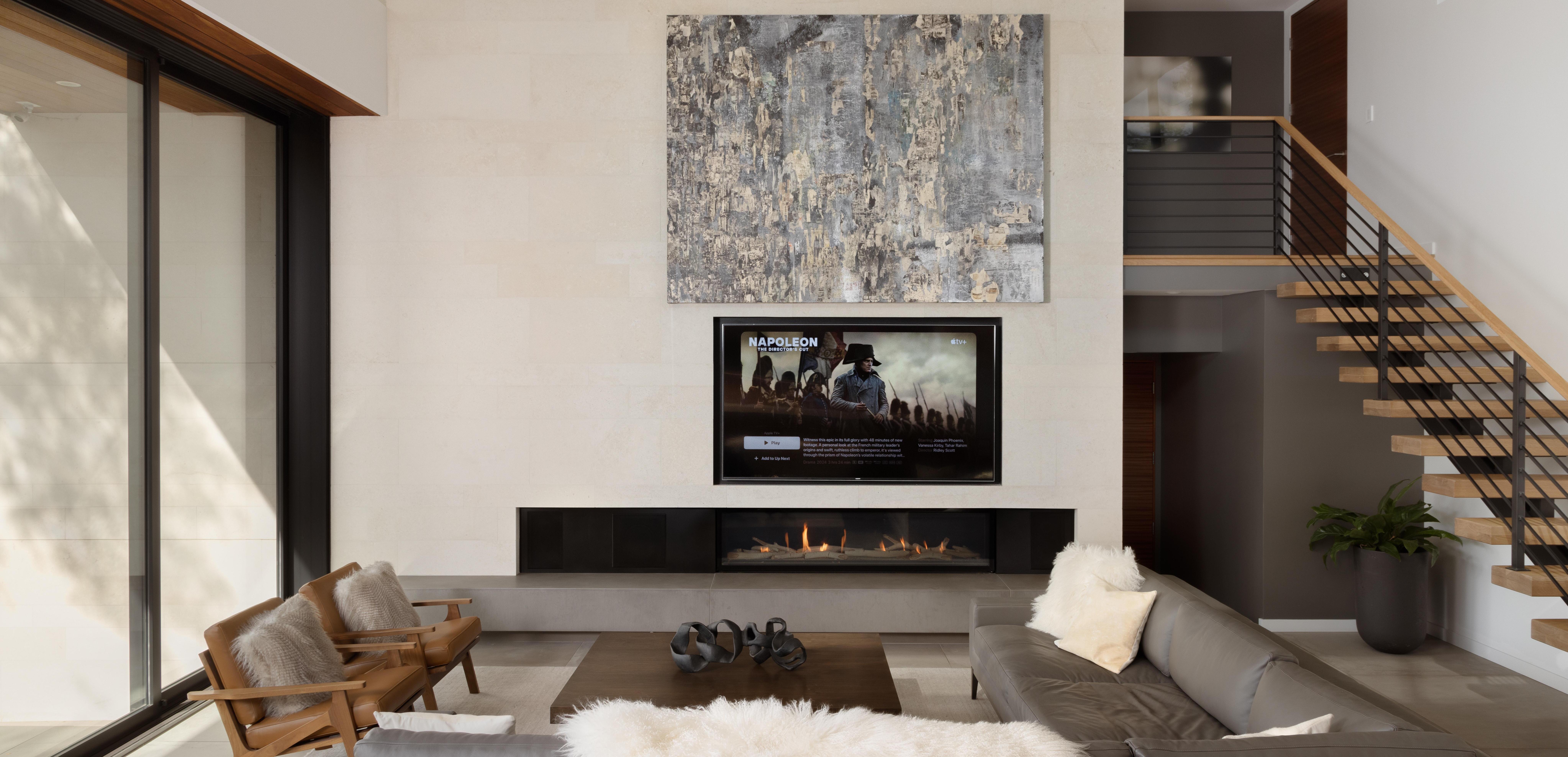 Aurum This room features an 85" TV that is concealed behind a large art piece that automatically lifts and lowers.