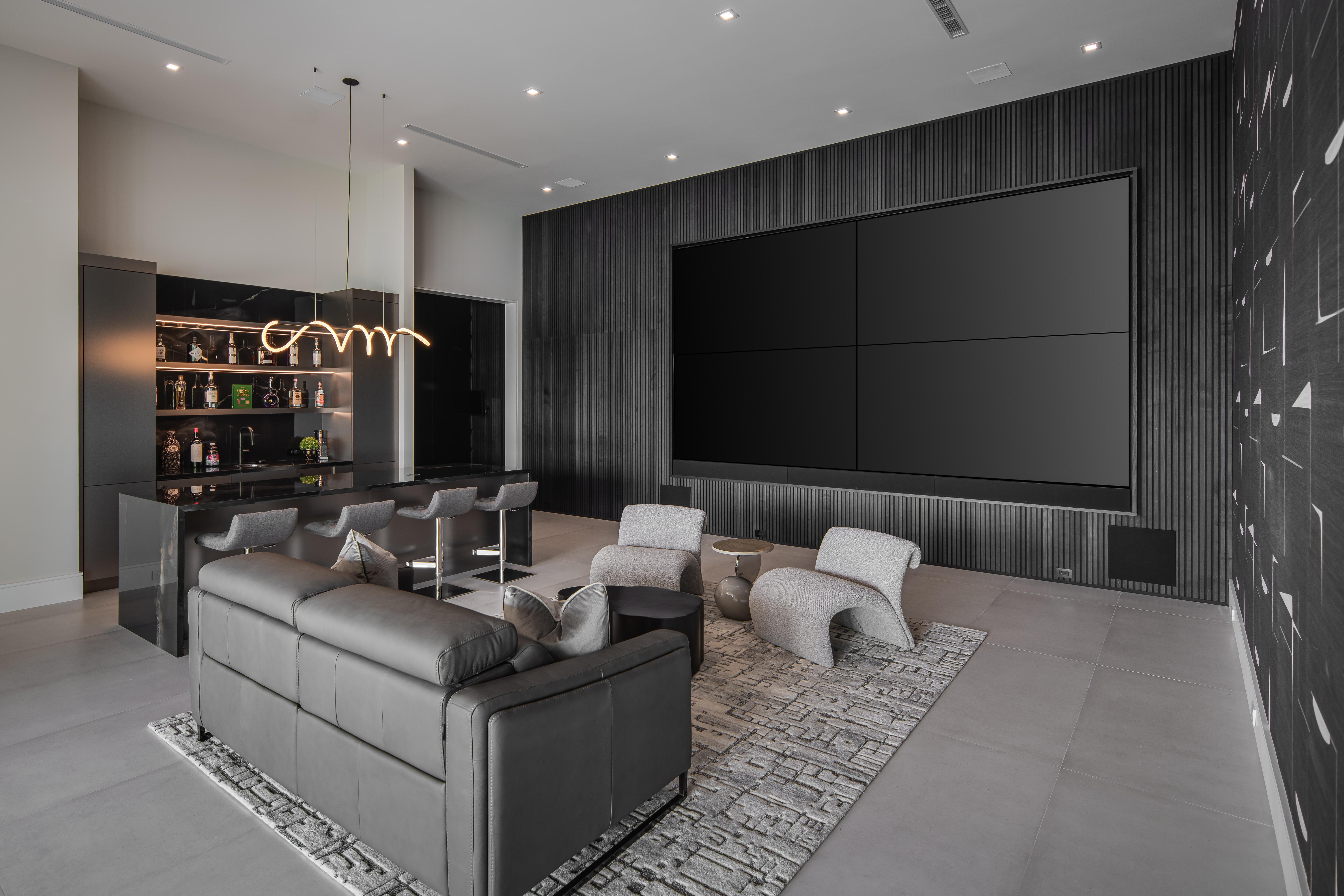 Petrone Technology Group Custom Leon audio, Samsung video wall, JL subs, and hidden networking for whole-home connectivity.