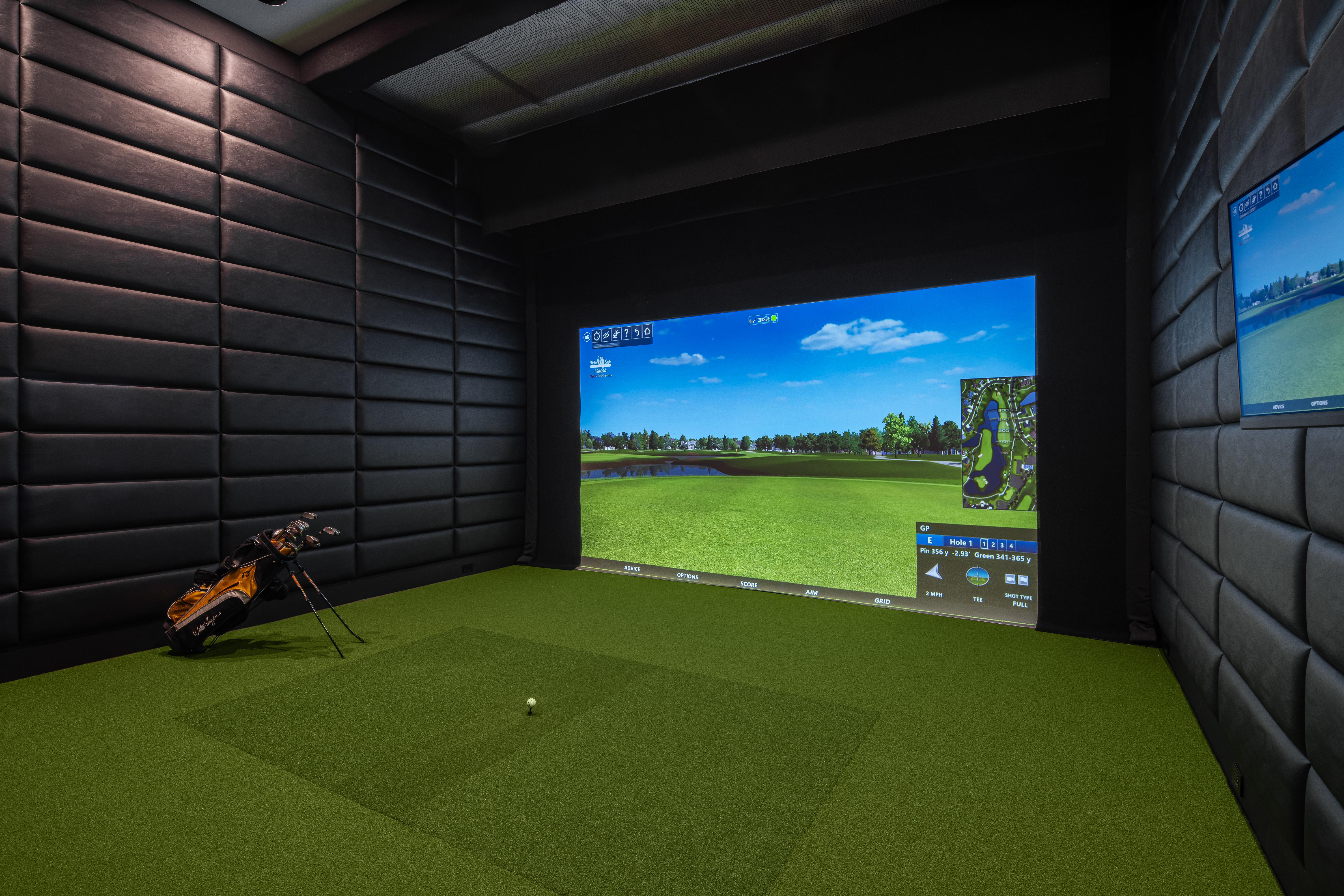 Petrone Technology Group Crestron control with MXNet video and integrated golf simulator in an acoustically treated media room.