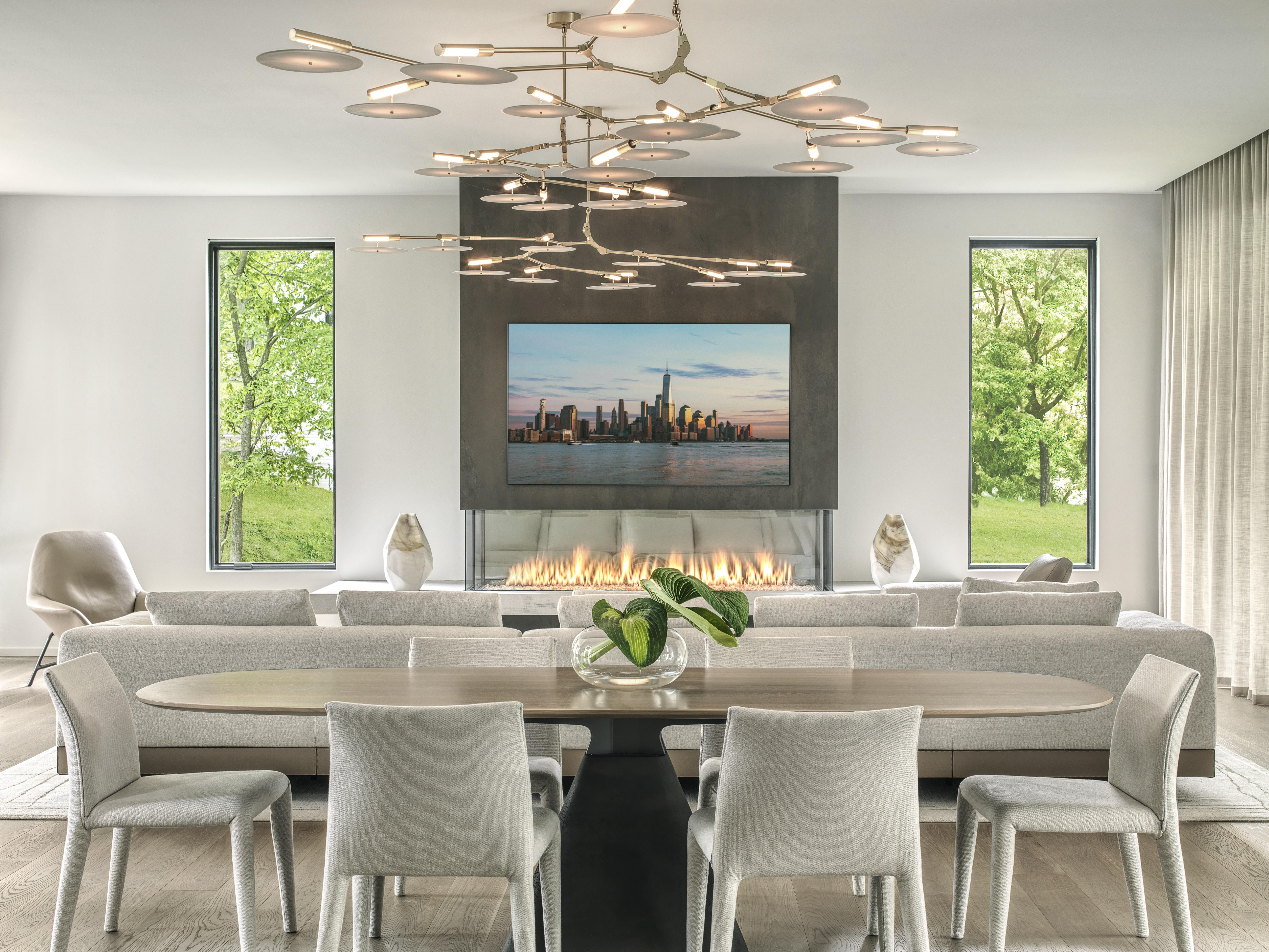 Walbrandt Electric & Technology OLED TV with recessed articulating mount in back box. Invisible Speakers in ceiling