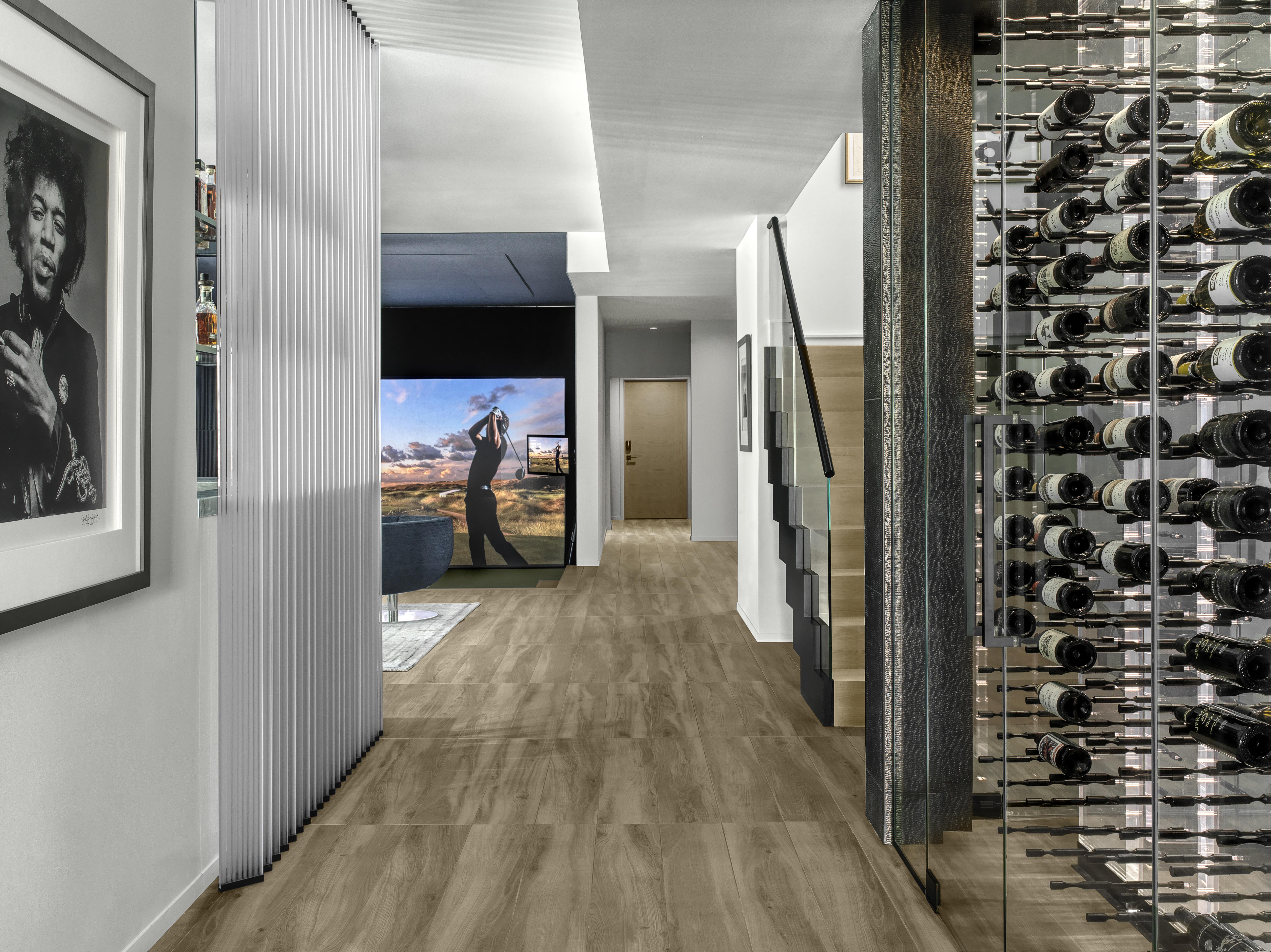 Walbrandt Electric & Technology Lower Level Golf Simulator.  Crestron lighting control, audio and video distribution, commercial grade network